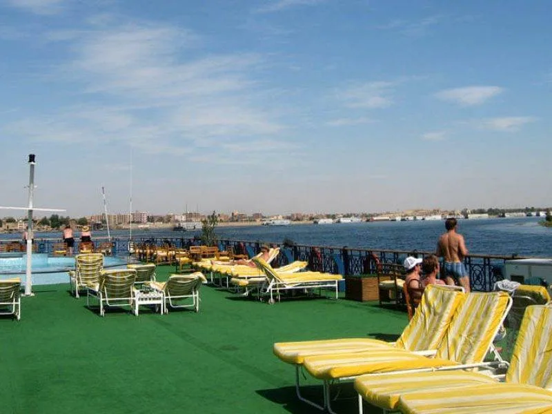 Mövenpick MS Royal Lily Nile Cruise sundeck with swimming pool and Nile views.