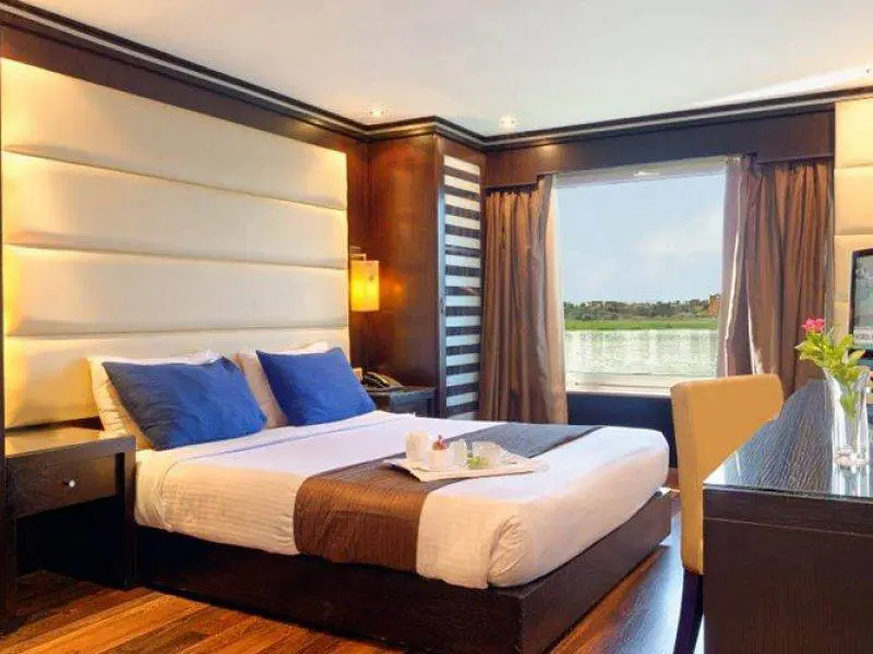 Nile Premium Nile Cruise deluxe cabin with panoramic Nile view