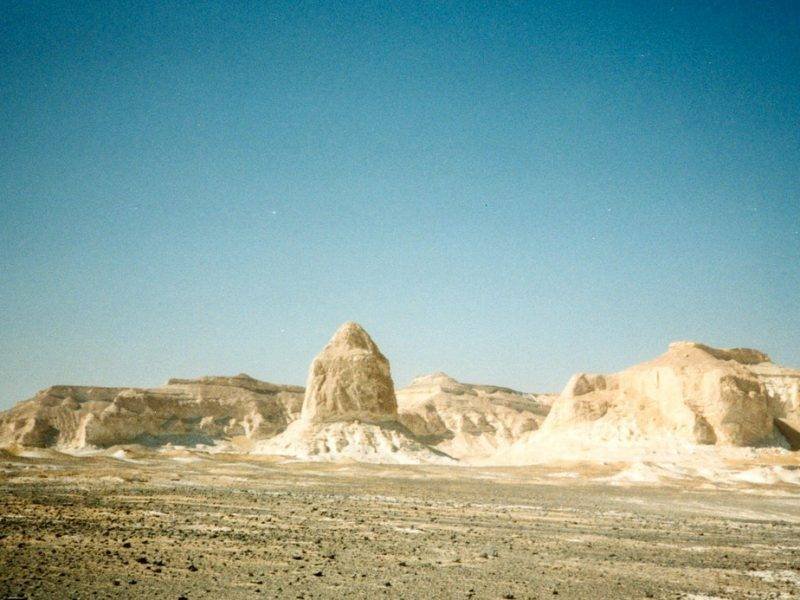 Golden sunrise over Egypt's Western Desert on a 10-day desert trekking tour
