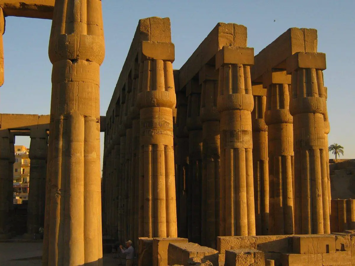 “Visitors admiring Luxor Temple at sunset