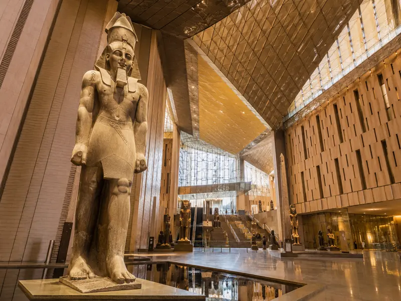 Colossal Ramses II statue inside the Grand Hall of the Grand Egyptian Museum in Giza Egypt