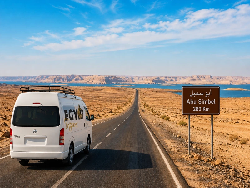 Road journey from Aswan to Abu Simbel through the Nubian desert