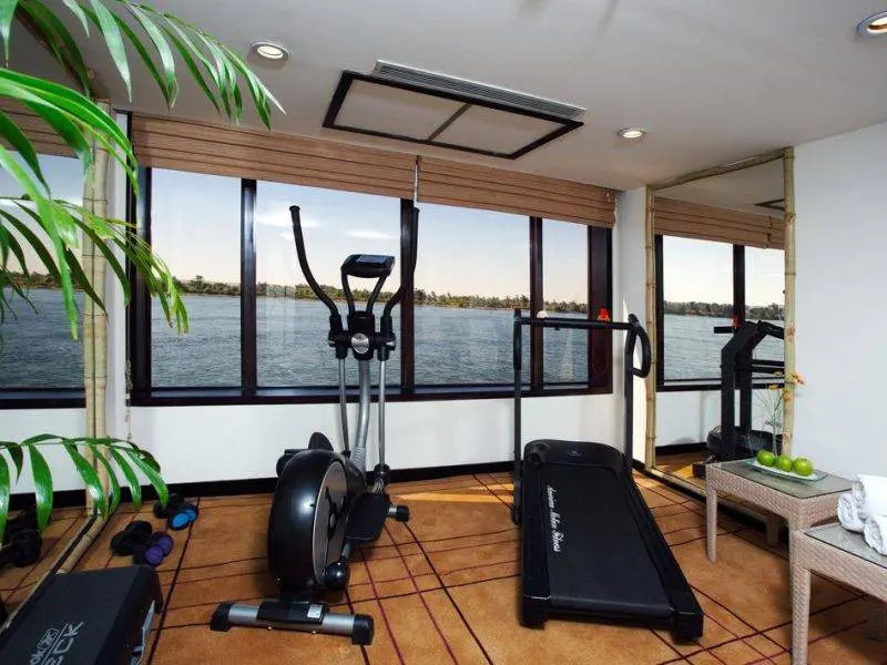 Modern gym onboard Mövenpick Royal Lotus Nile Cruise with panoramic Nile views