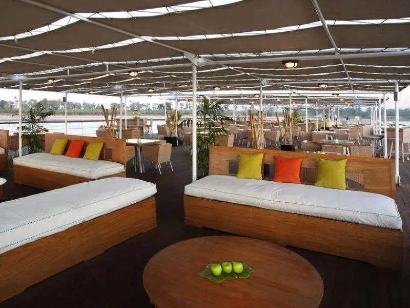 Guests enjoying the sun deck of Mövenpick Royal Lotus Nile Cruise with Nile views